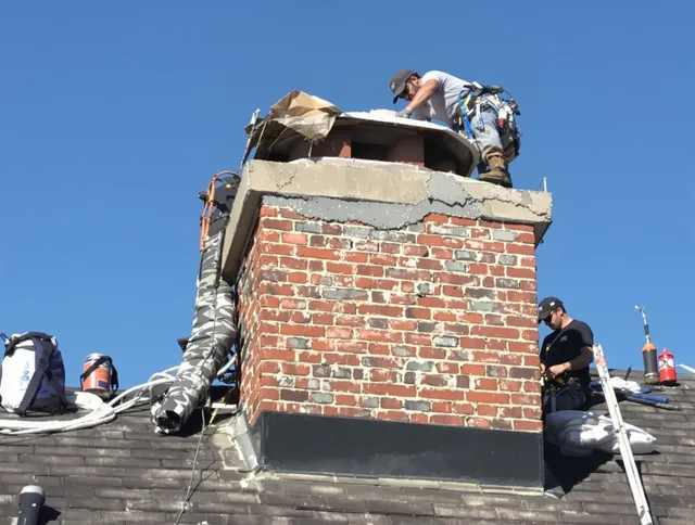 Waterford Chimney Sweep installing a custom chimney crown in Waterford, CT