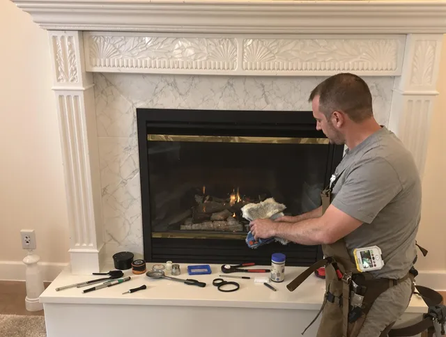 Waterford Chimney Sweep performing fireplace maintenance in Waterford, CT