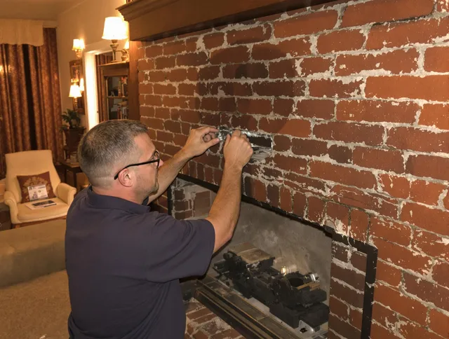 Waterford Chimney Sweep expert fixing a fireplace in Waterford, CT